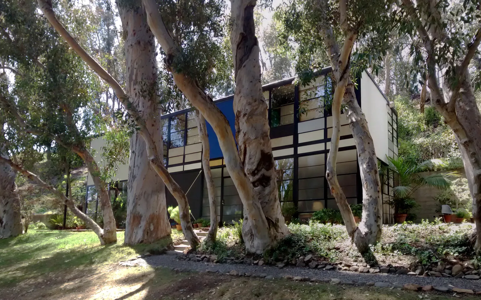 The Eames House exterior, a landmark mid-century modern residence with clean lines and expansive glass walls